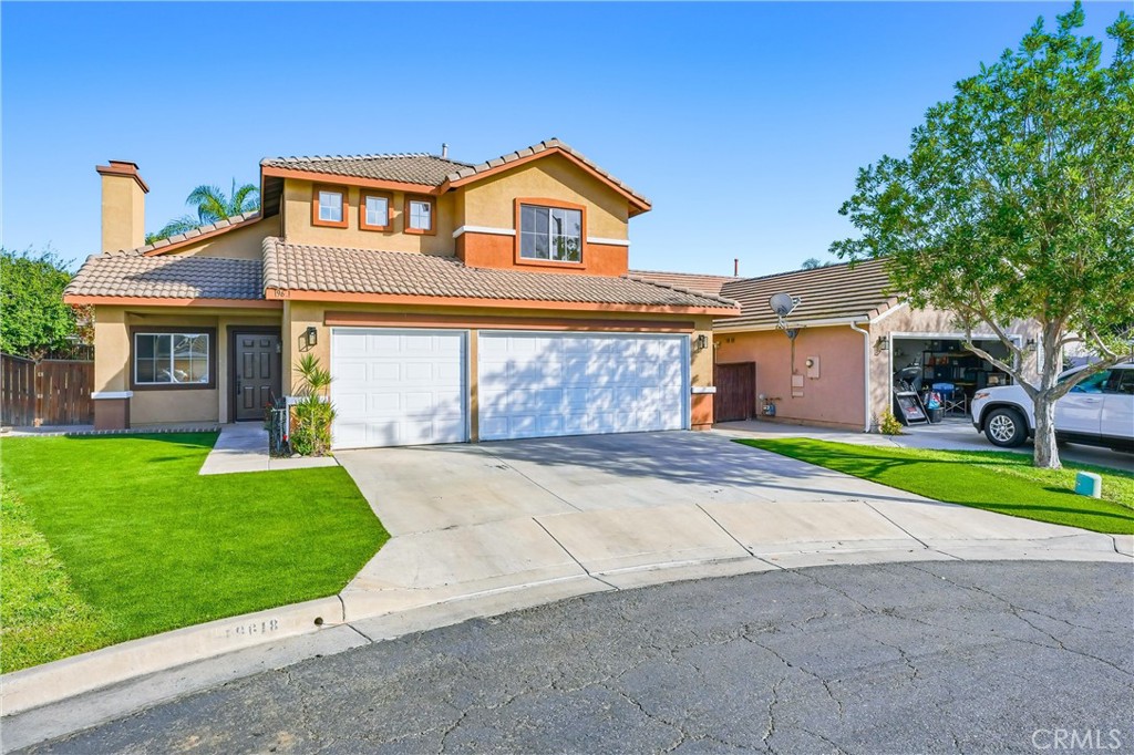 19618 Jill Court Riverside, CA 92508 - Photo 1 of 1 a front view of a house with a yard and garage