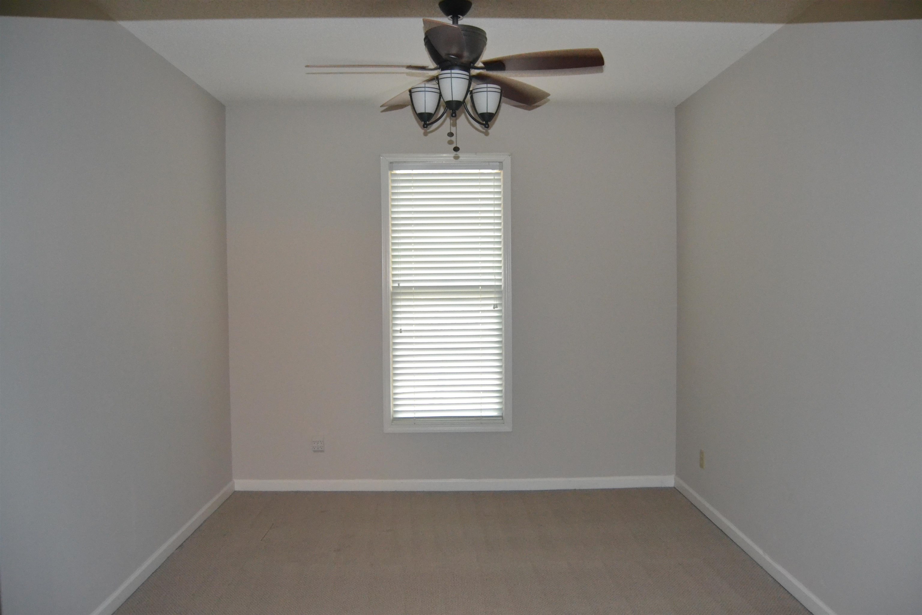 10486 Juneau Way Collierville, TN 38017 - Photo 24 of 33 Empty room with ceiling fan and a healthy amount of sunlight