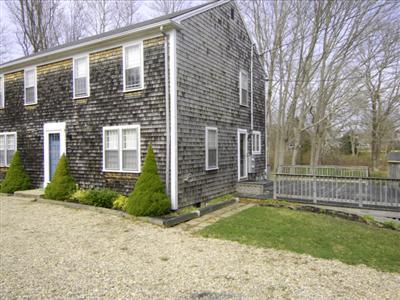 223 Rock Harbor Road, Unit D Orleans, MA 02653 - Photo 1 of 8 a front view of a house with garden