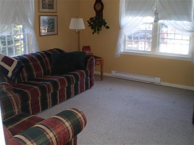 223 Rock Harbor Road, Unit D Orleans, MA 02653 - Photo 5 of 8 a living room with furniture