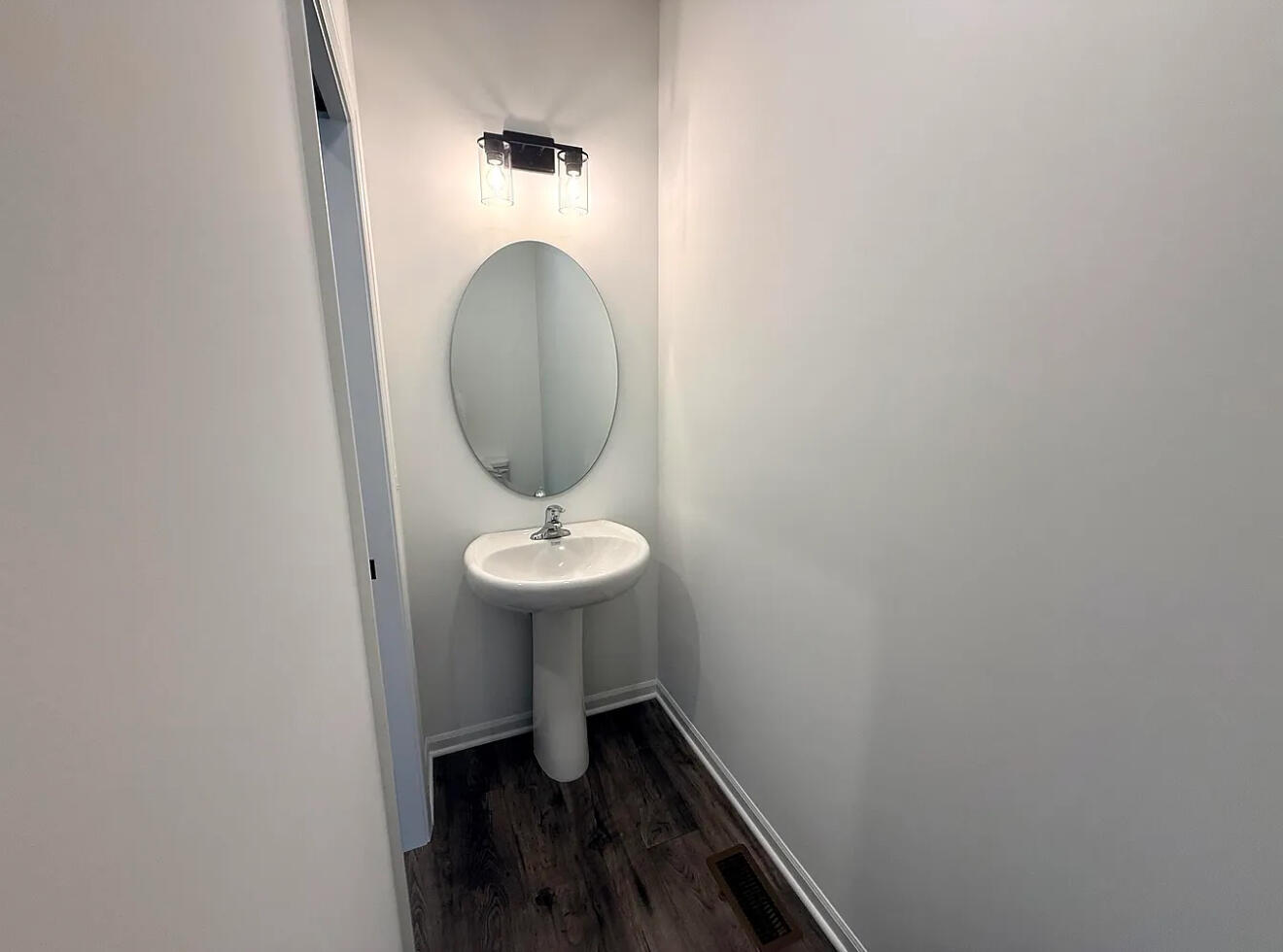 717 Lake Street Hobart, IN 46342 - Photo 5 of 25 a room with a sink and a mirror