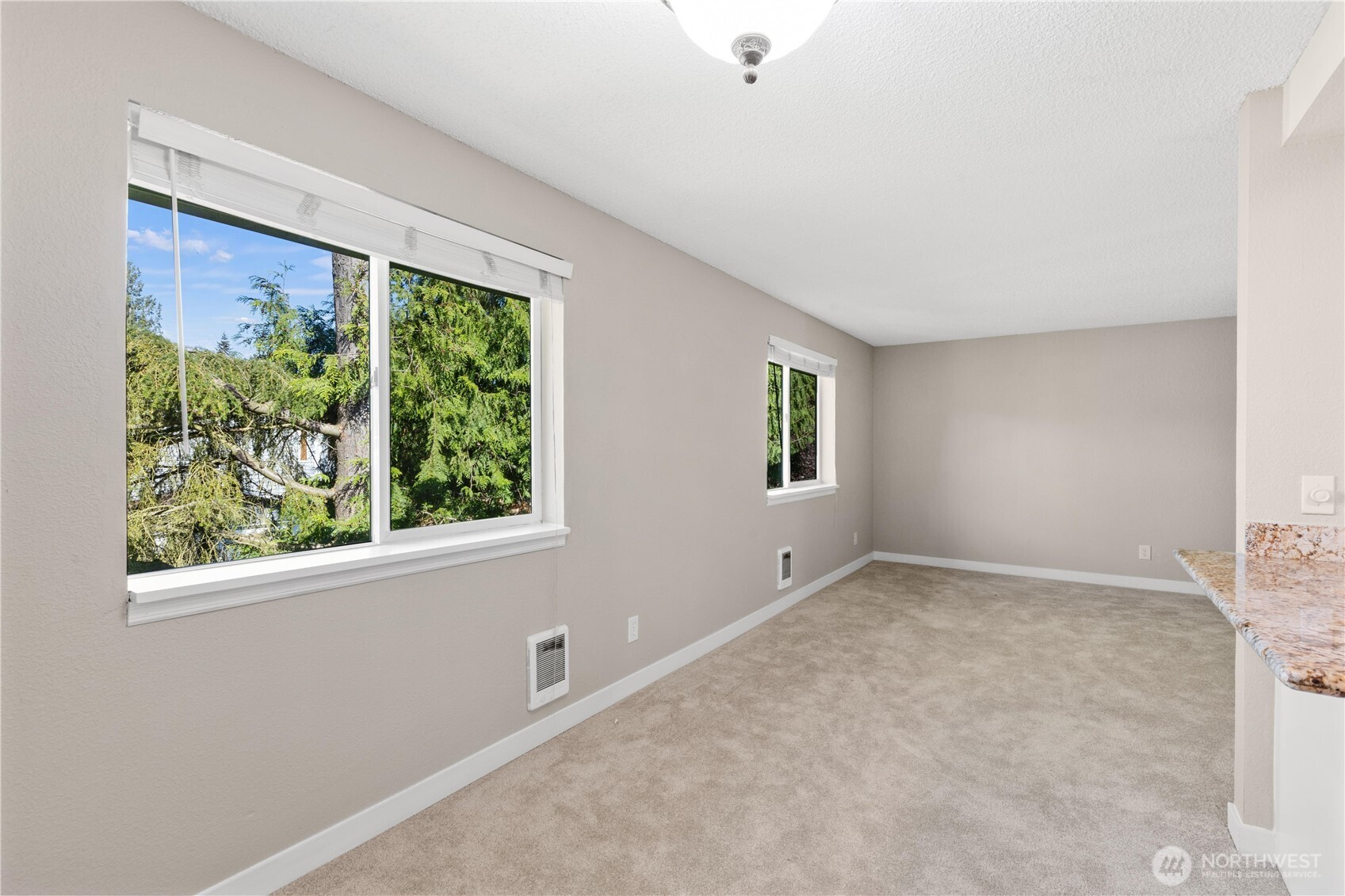 7700 196th Street Southwest, Unit C Edmonds, WA 98036 - Photo 11 of 26 an empty room with windows
