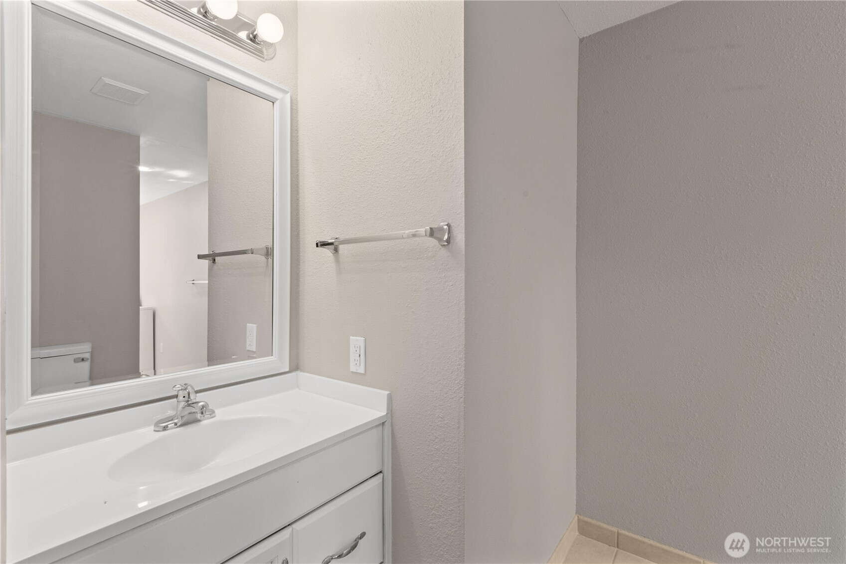 7700 196th Street Southwest, Unit C Edmonds, WA 98036 - Photo 16 of 26 a bathroom with a sink and a mirror