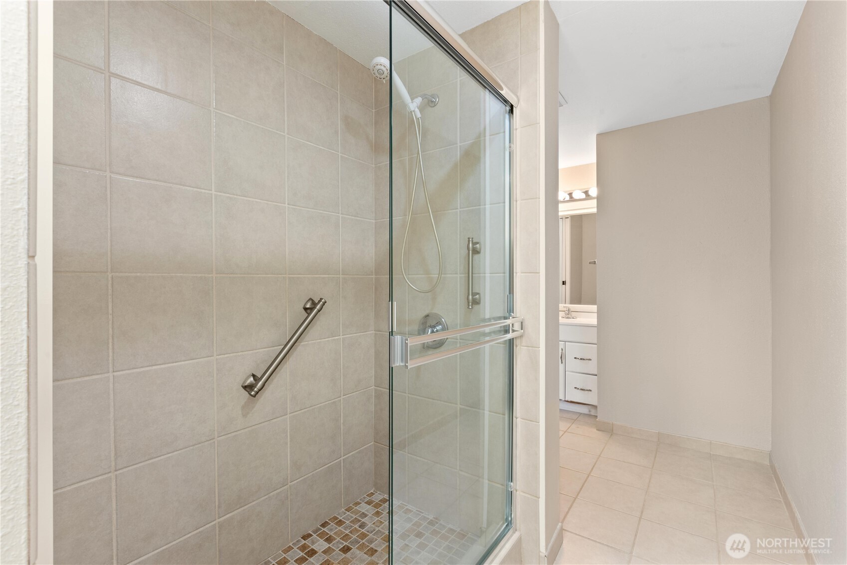 7700 196th Street Southwest, Unit C Edmonds, WA 98036 - Photo 18 of 26 a bathroom with a glass shower door