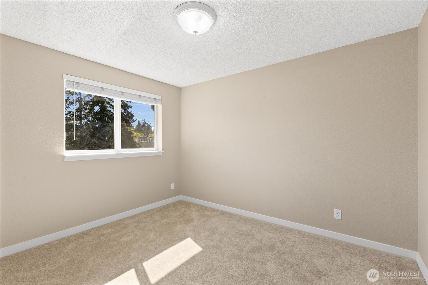 7700 196th Street Southwest, Unit C Edmonds, WA 98036 - Photo 20 of 26 an empty room with a window