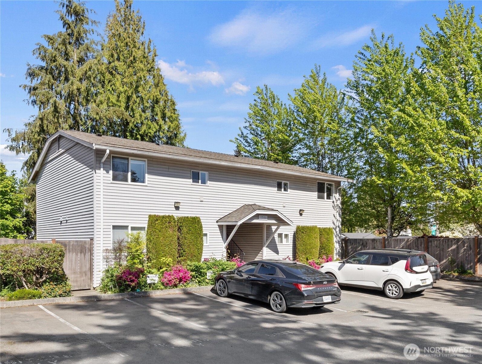 7700 196th Street Southwest, Unit C Edmonds, WA 98036 - Photo 24 of 26 a front view of a house with garden