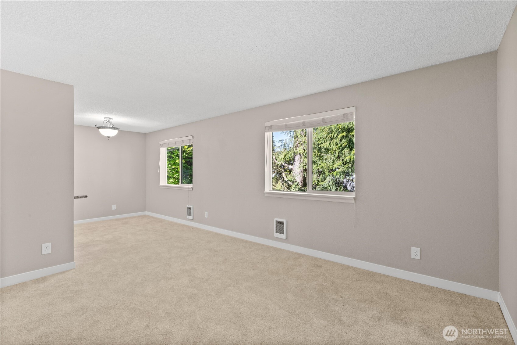 7700 196th Street Southwest, Unit C Edmonds, WA 98036 - Photo 6 of 26 an empty room with windows