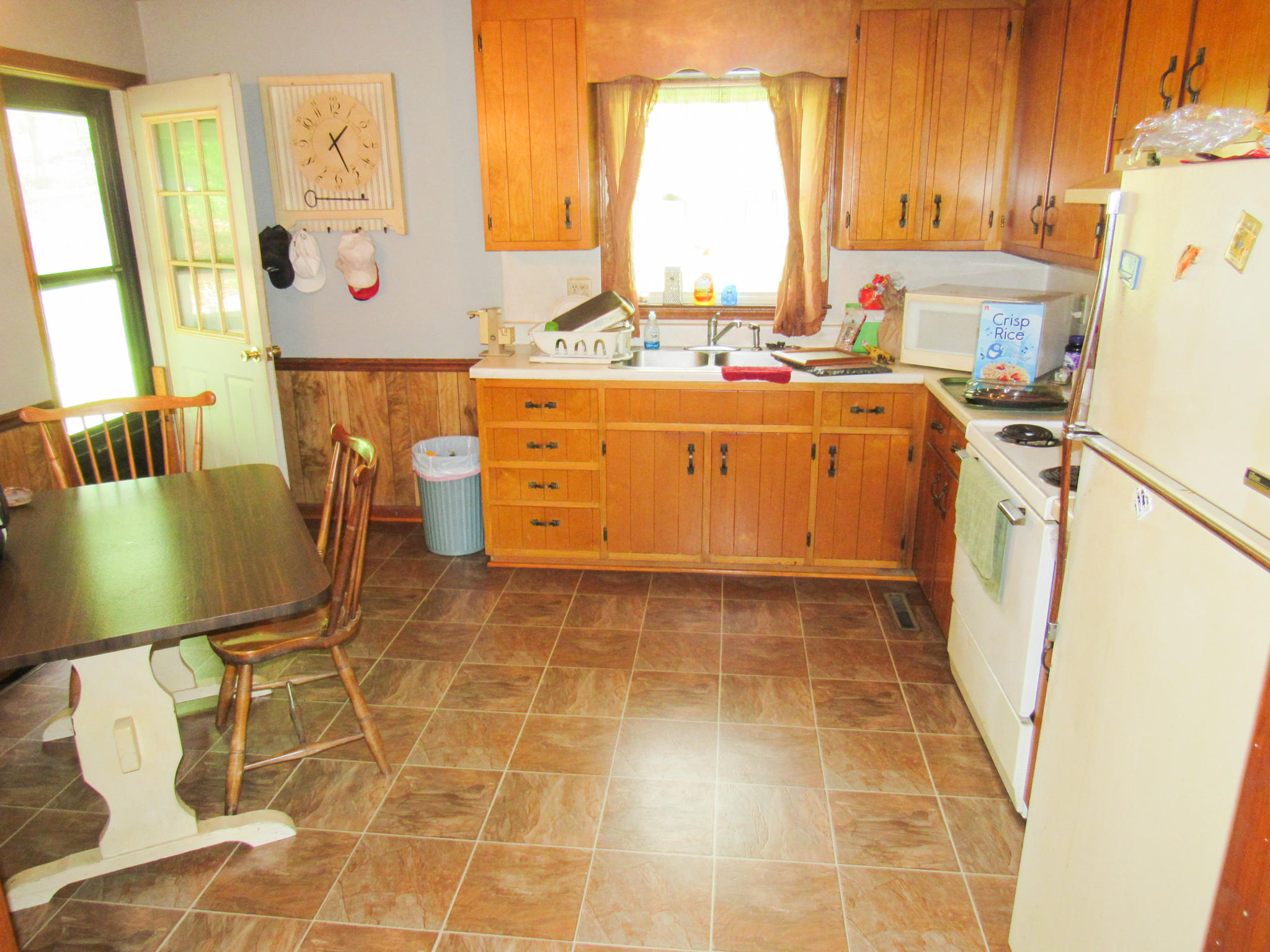 2589 Old Ferrum Road Ferrum, VA 24088 - Photo 11 of 30 a room with a table chairs and a refrigerator