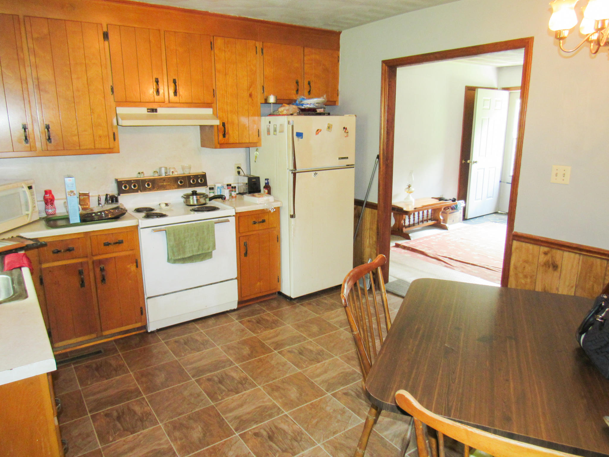 2589 Old Ferrum Road Ferrum, VA 24088 - Photo 12 of 30 a kitchen with a stove a refrigerator and a sink