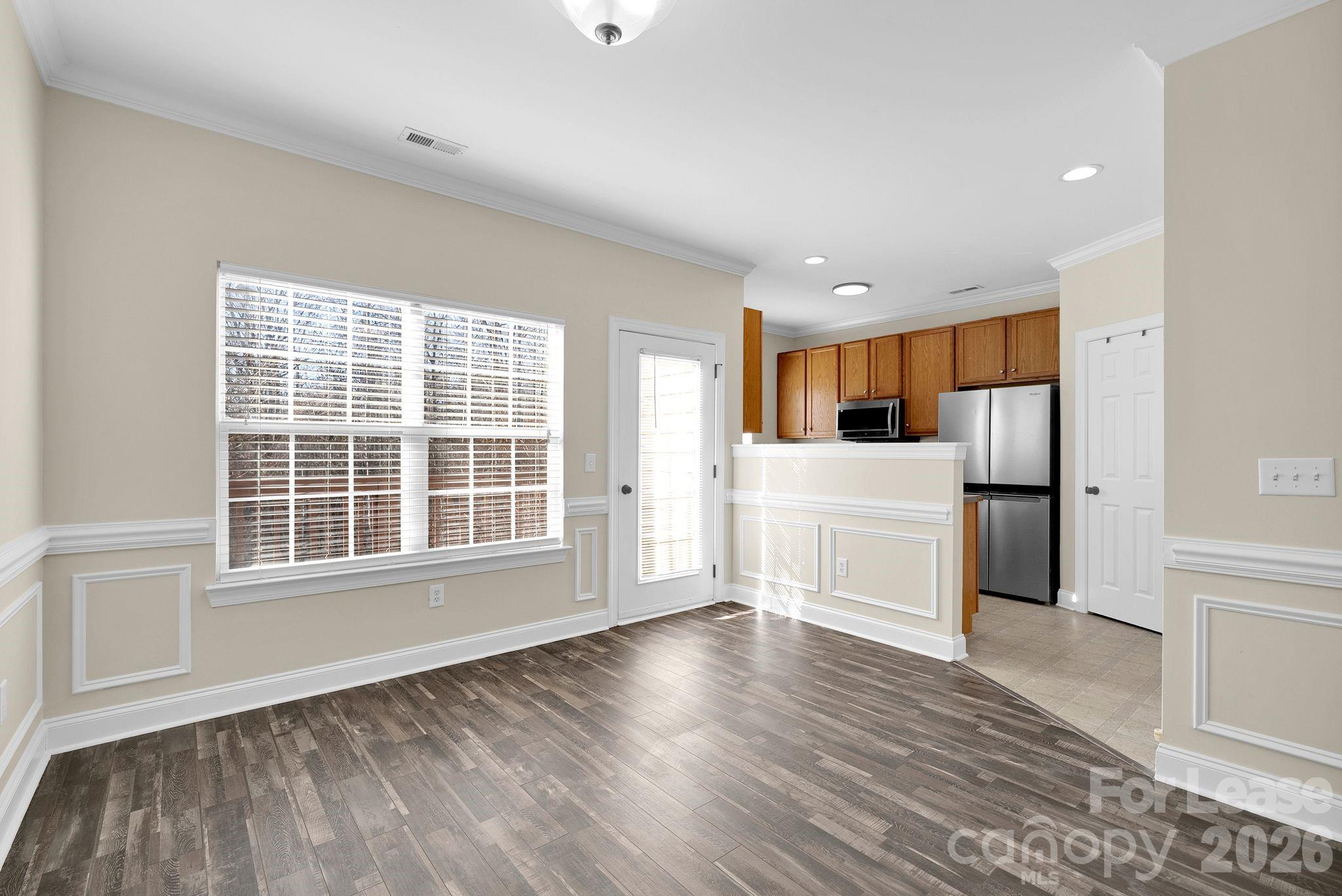 163 Forest Ridge Road Mooresville, NC 28117 - Photo 12 of 48 a view of empty room with wooden floor and window