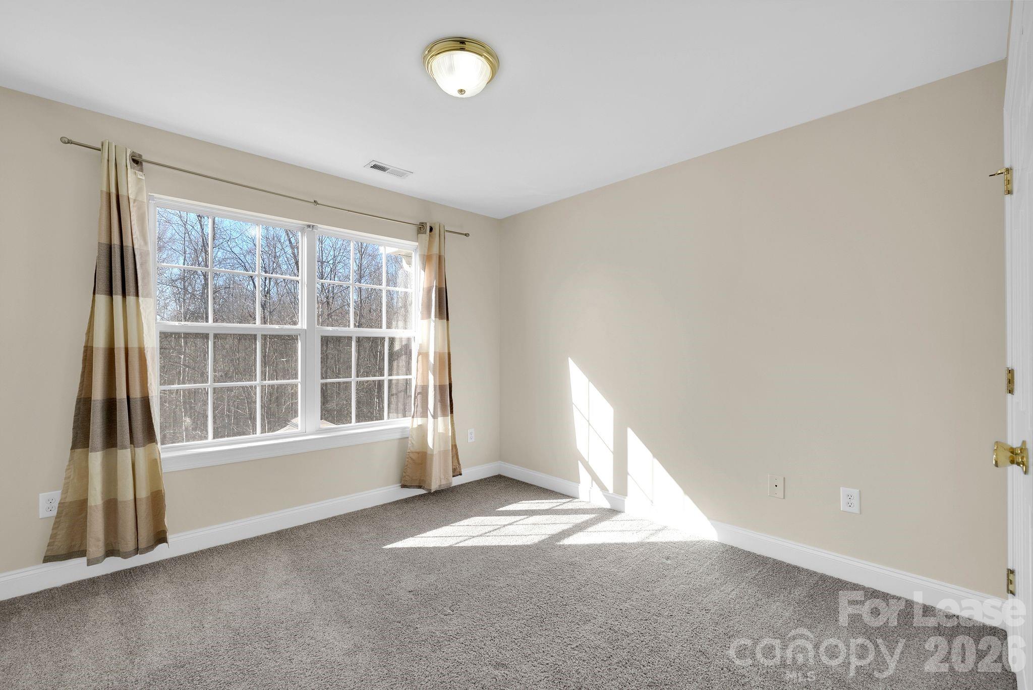 163 Forest Ridge Road Mooresville, NC 28117 - Photo 17 of 48 an empty room with a window