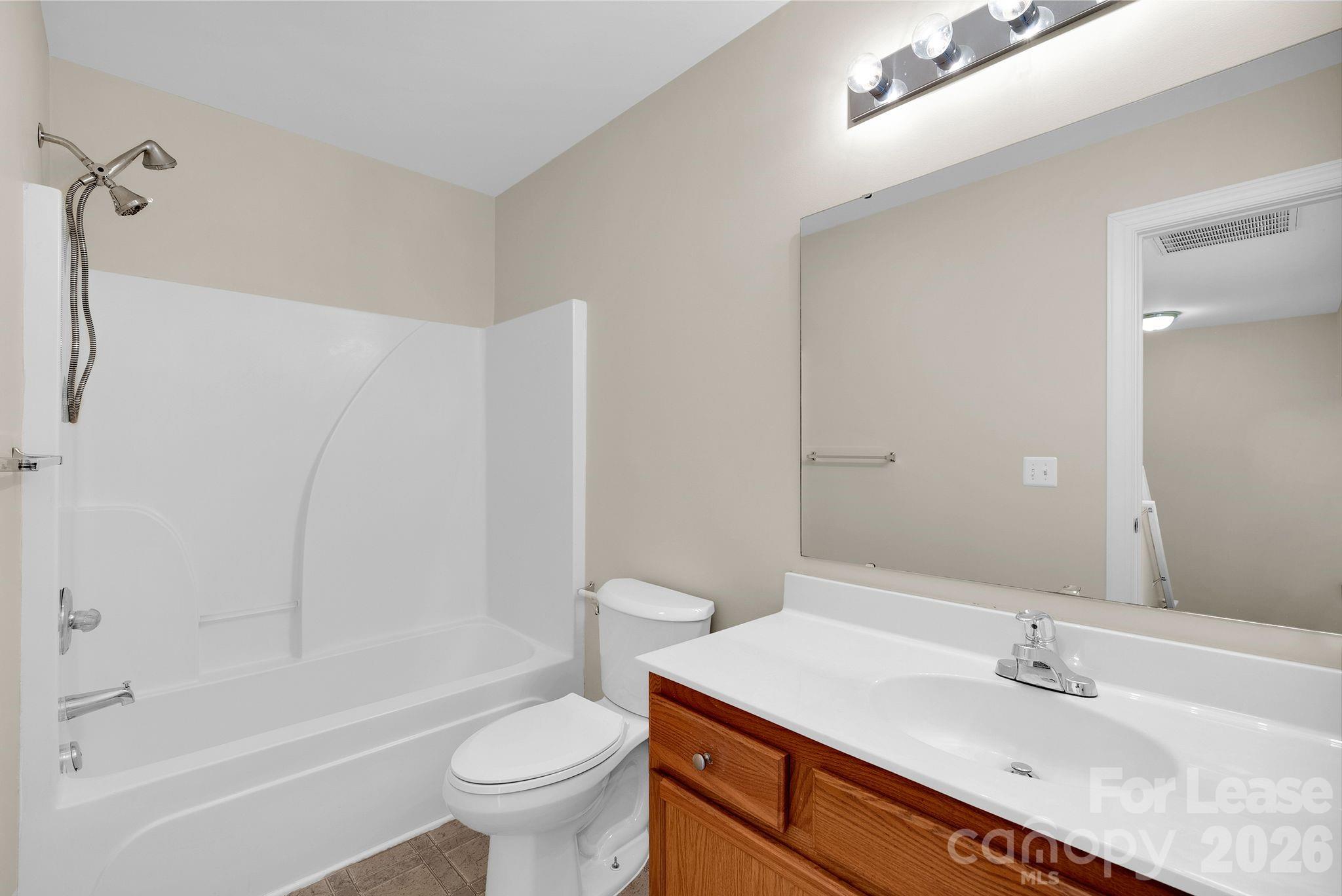 163 Forest Ridge Road Mooresville, NC 28117 - Photo 21 of 48 a bathroom with a granite countertop sink a toilet and shower