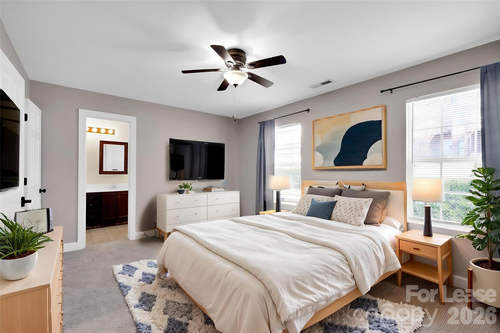 163 Forest Ridge Road Mooresville, NC 28117 - Photo 4 of 48 a bedroom with a bed and a flat screen tv