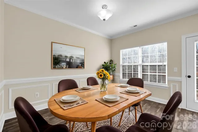 a view of a dining room with furniture and window