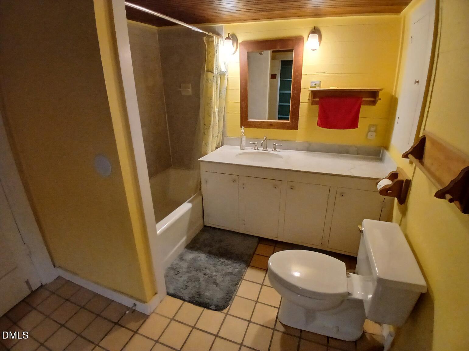 1920 Kelly Road Apex, NC 27502 - Photo 17 of 44 a bathroom with a sink and a mirror