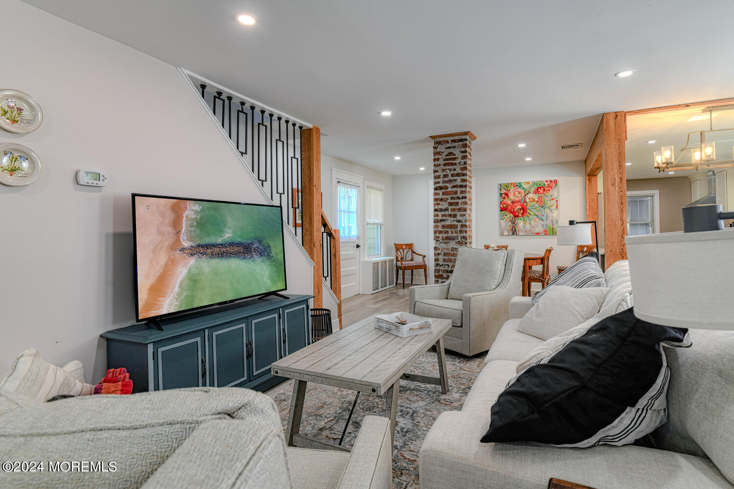83 Broadway Ocean Grove, NJ 07756 - Photo 15 of 37 a living room with furniture and a flat screen tv