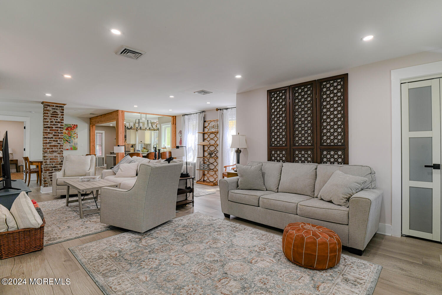 83 Broadway Ocean Grove, NJ 07756 - Photo 16 of 37 a living room with furniture and a large window