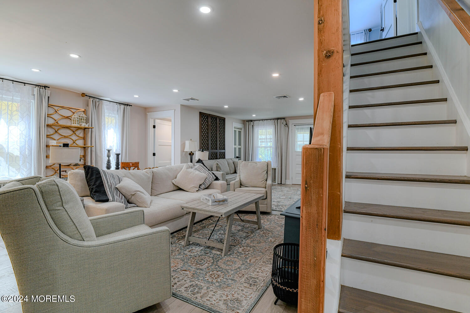 83 Broadway Ocean Grove, NJ 07756 - Photo 18 of 37 a living room with furniture kitchen view and a wooden floor
