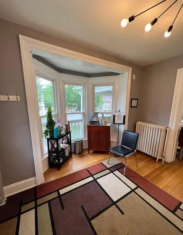 a view of a livingroom with furniture and a flat screen tv