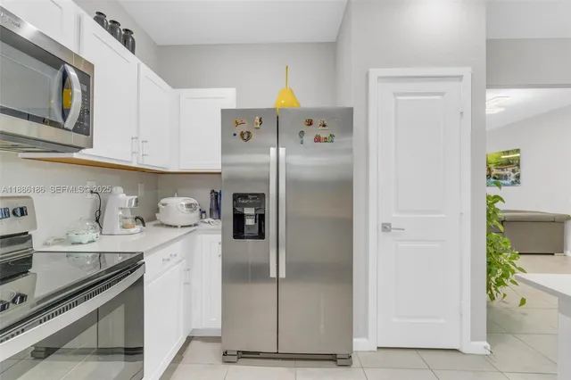 a kitchen with a sink cabinets and window