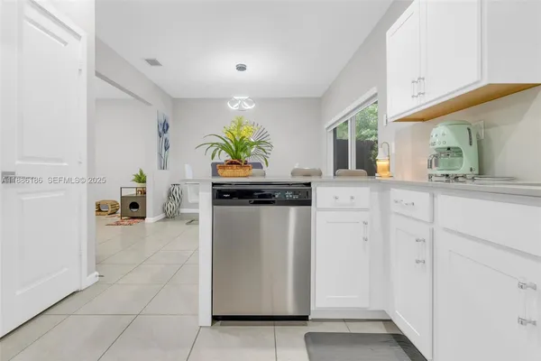 a kitchen with refrigerator and counter