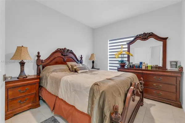 a bedroom with a bed and a closet