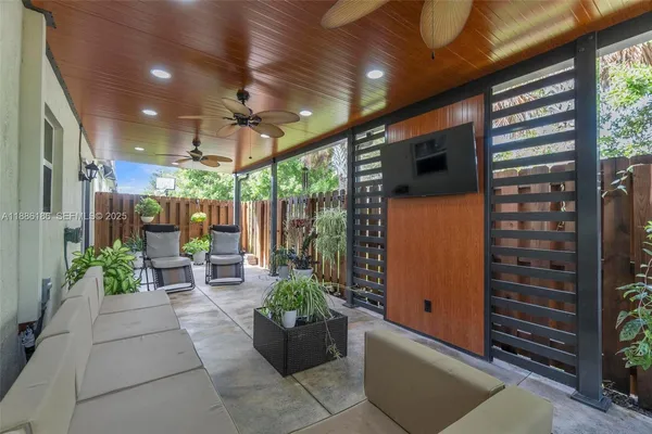 a view of a porch with potted plants