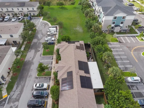 an aerial view of residential building and lake
