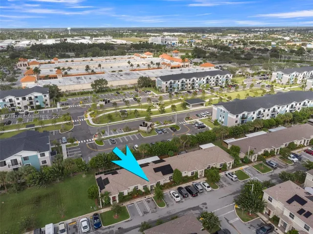 an aerial view of residential building and lake