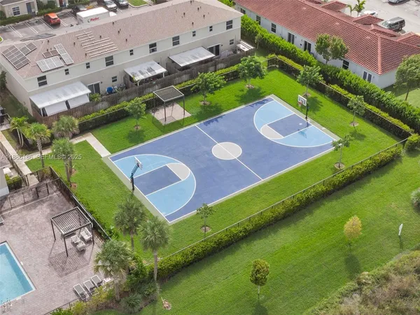 a view of house with backyard space and lake view