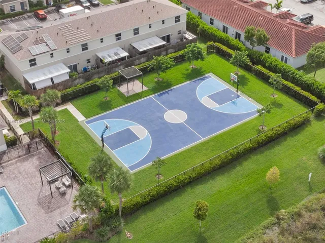 a view of house with backyard space and lake view
