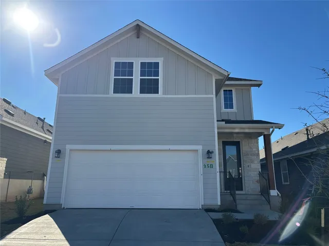 a front view of a house with garage