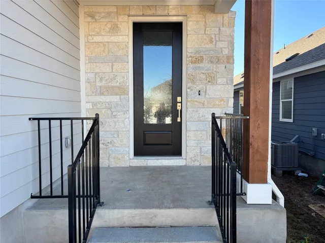 a view of kitchen with sink and wooden floor