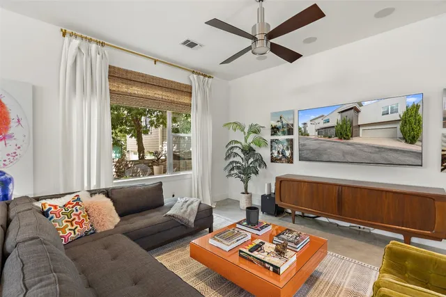 a view of a hallway with wooden floor and stairs
