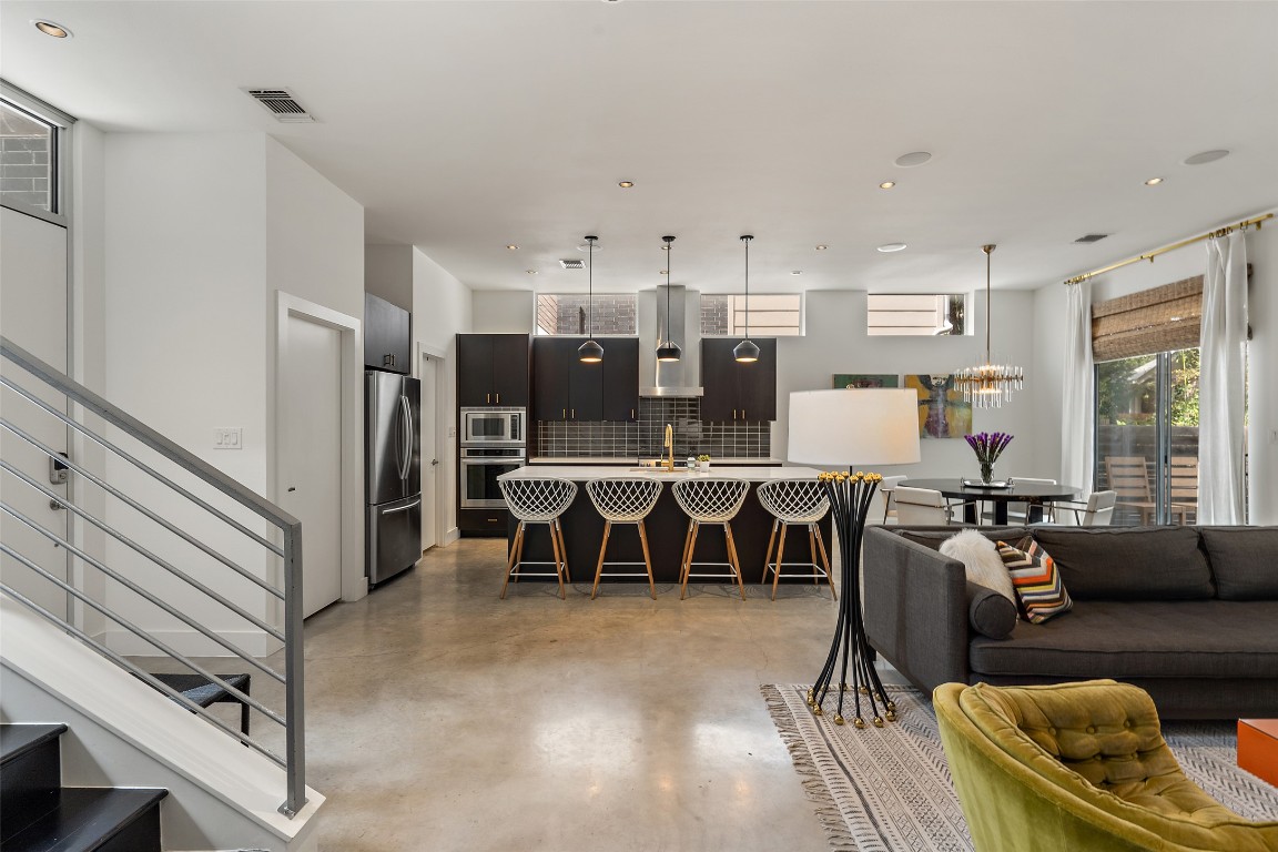 2105 Goodrich Avenue, Unit 2 Austin, TX 78704 - Photo 18 of 40 a living room with lots of furniture and kitchen view