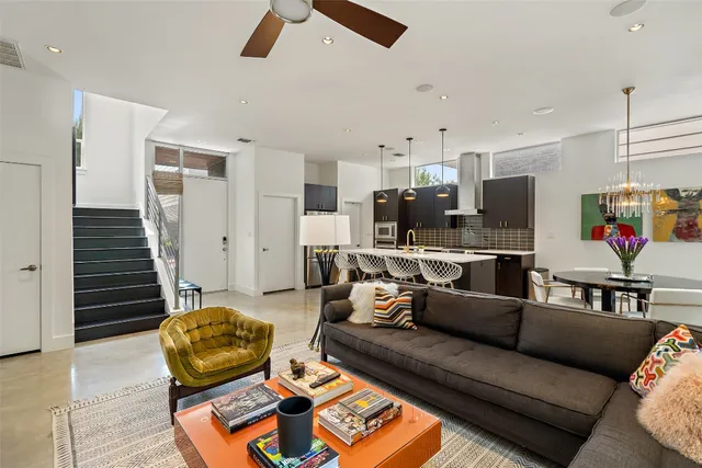 a living room with furniture and a rug