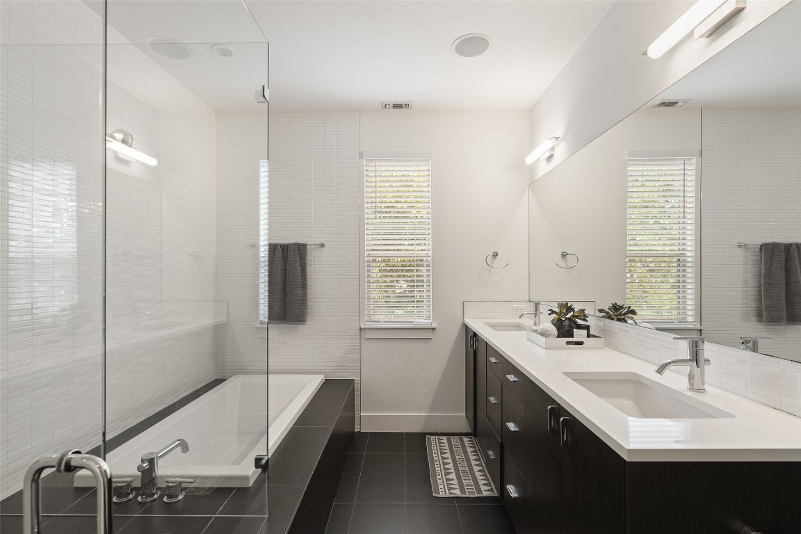 2105 Goodrich Avenue, Unit 2 Austin, TX 78704 - Photo 24 of 40 a bathroom with a tub sink and mirror