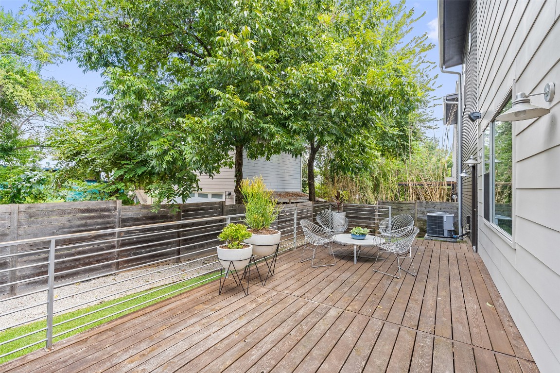 2105 Goodrich Avenue, Unit 2 Austin, TX 78704 - Photo 33 of 40 a view of a deck with chairs and wooden floor