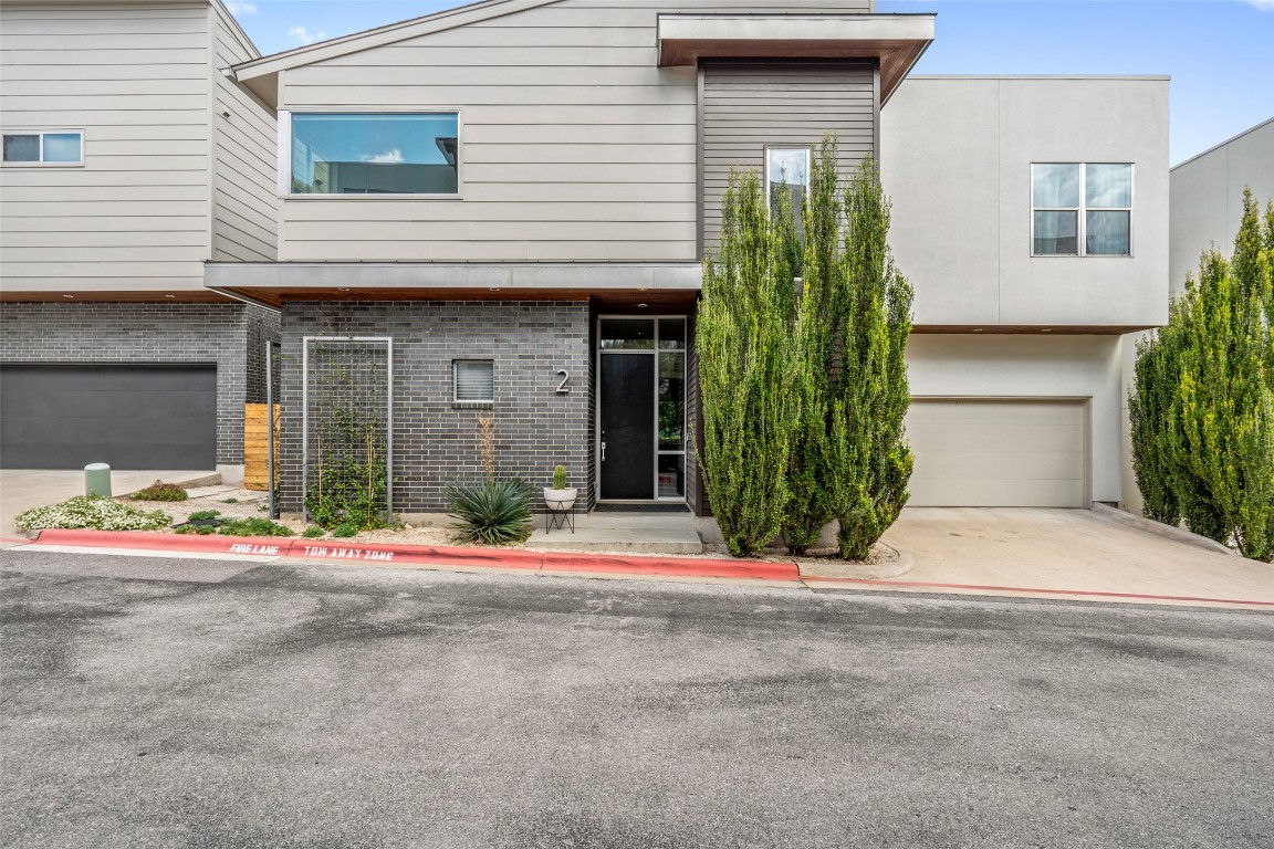 2105 Goodrich Avenue, Unit 2 Austin, TX 78704 - Photo 39 of 40 a front view of a house with a yard and garage
