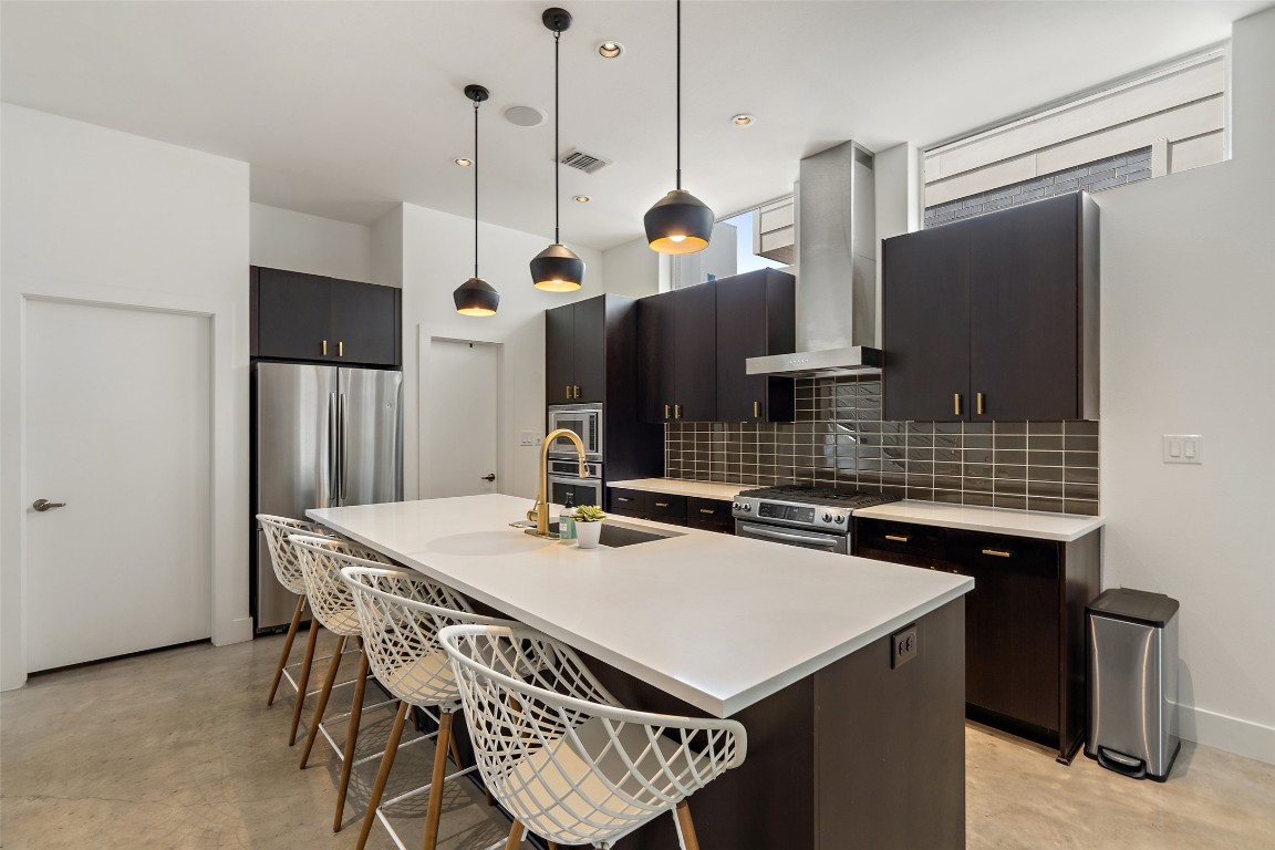 2105 Goodrich Avenue, Unit 2 Austin, TX 78704 - Photo 4 of 40 a kitchen with a sink a refrigerator a stove and a kitchen island