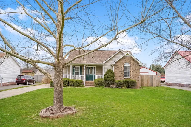 a front view of house with a garden