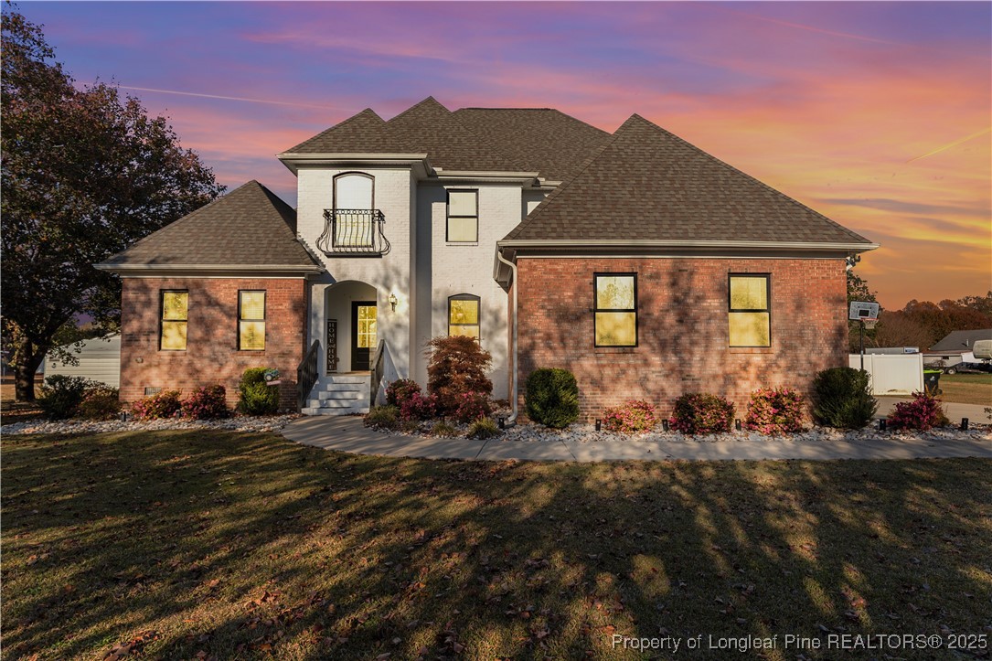 a front view of a house with a yard