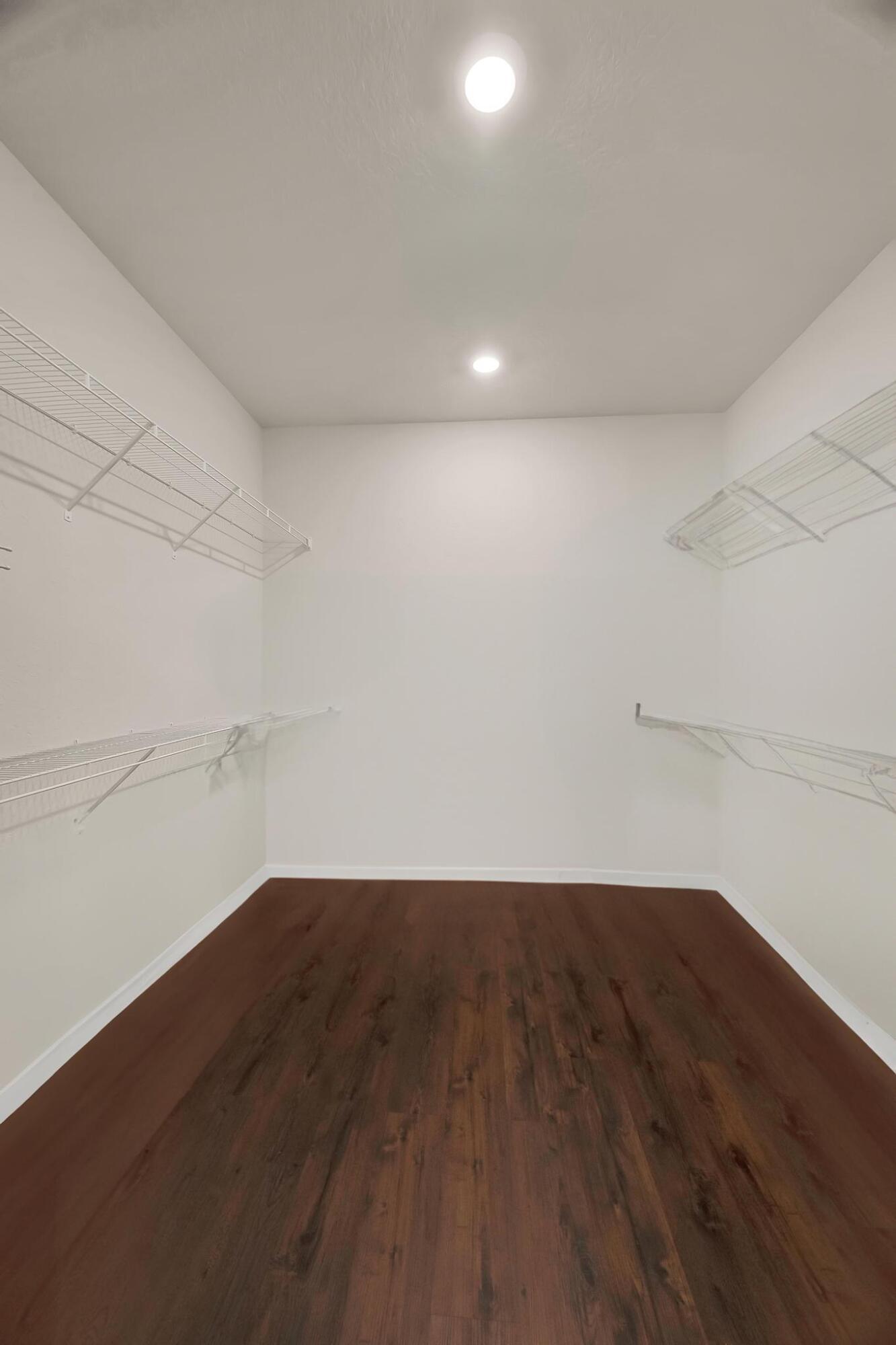 680 Southeast Villandry Way Port St. Lucie, FL 34984 - Photo 14 of 38 a view of a room with wooden floor