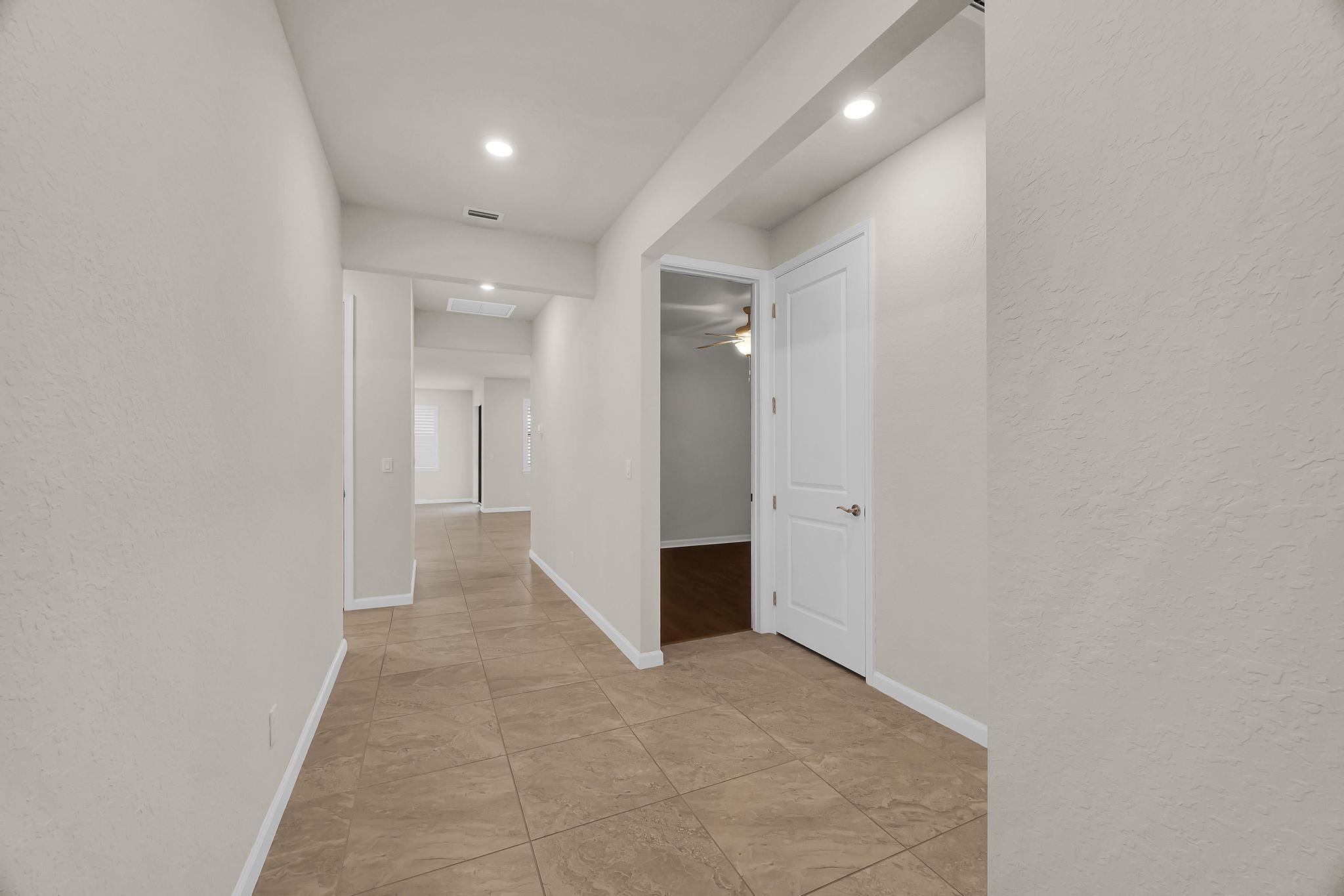 680 Southeast Villandry Way Port St. Lucie, FL 34984 - Photo 21 of 38 a view of a hallway