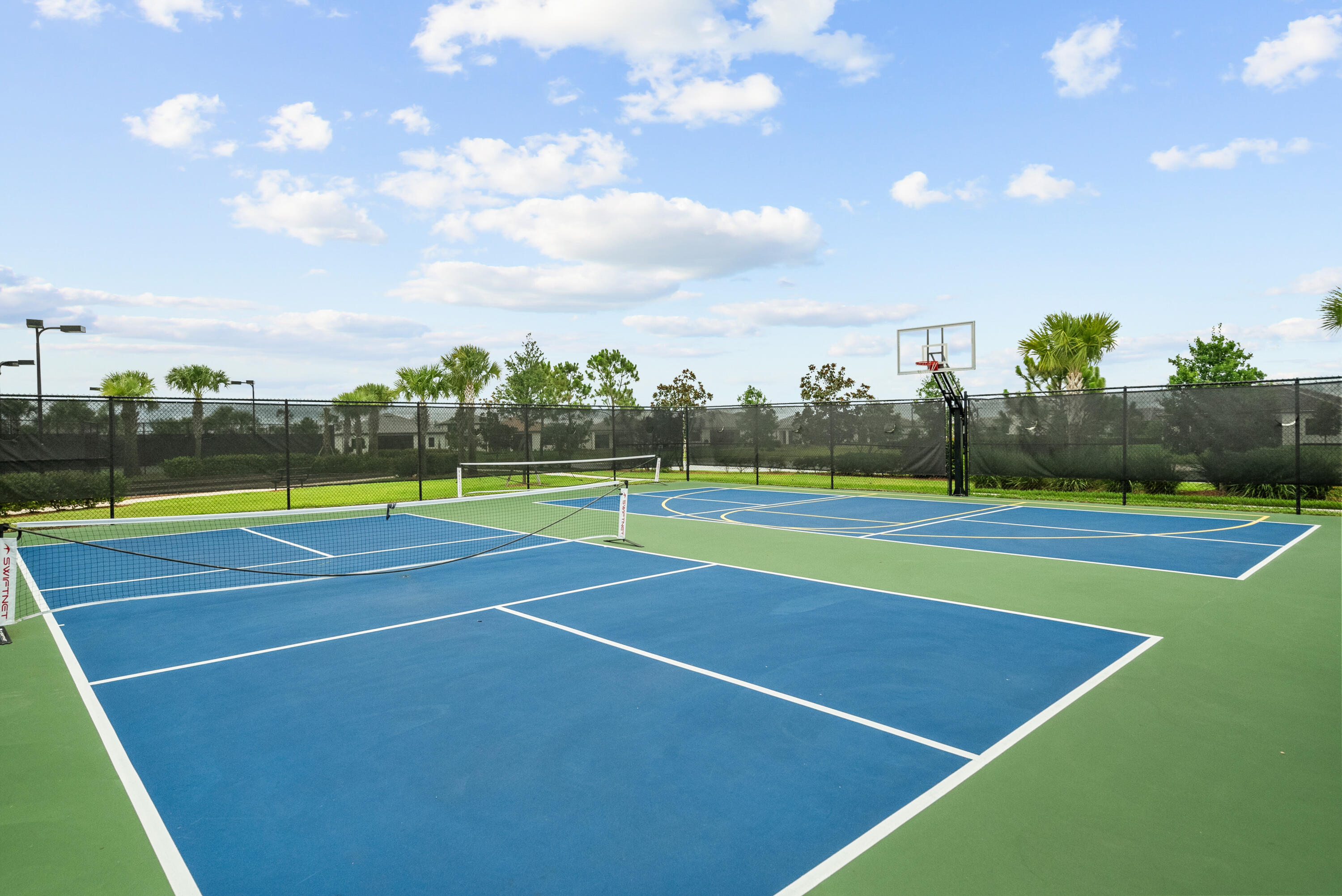 680 Southeast Villandry Way Port St. Lucie, FL 34984 - Photo 35 of 38 a view of a tennis court