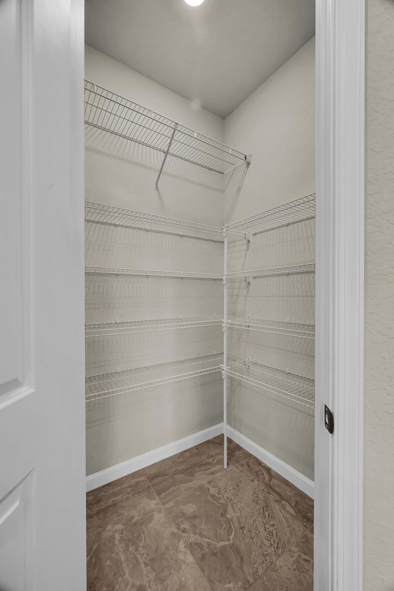 680 Southeast Villandry Way Port St. Lucie, FL 34984 - Photo 8 of 38 a view of an empty room