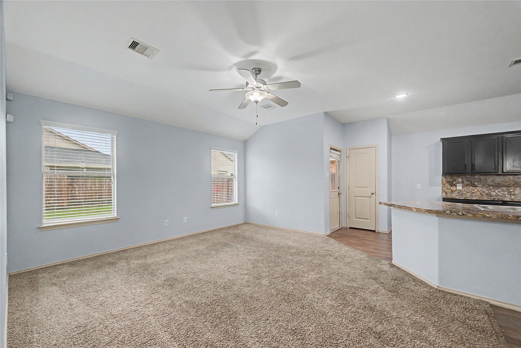 16430 Rodeo River Road Houston, TX 77049 - Photo 20 of 34 a view of workspace room with wooden floor and a ceiling fan