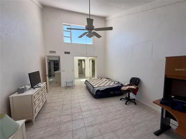 a bedroom with bed and window