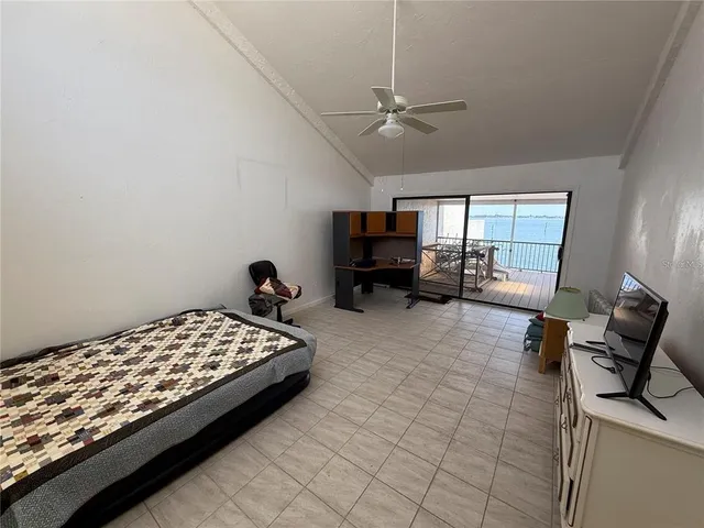 a bedroom with bed and window