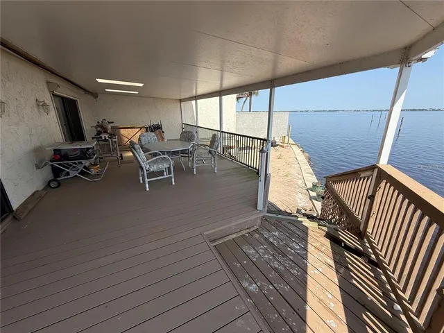 a view of a balcony with chairs